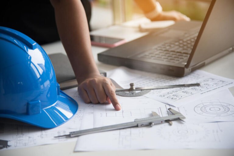 Woman mechanical engineer working on engineer workplace