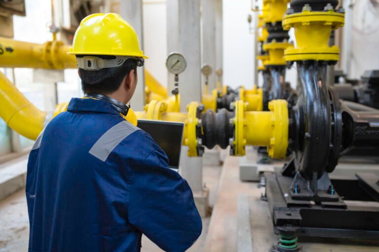 maintenance-technician-heating-plantpetrochemical-workers-supervise-operation-gas-oil-pipelines-factoryengineers-put-hearing-protector-room-with-many-pipes